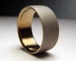Gold and gray. wide. titanium band