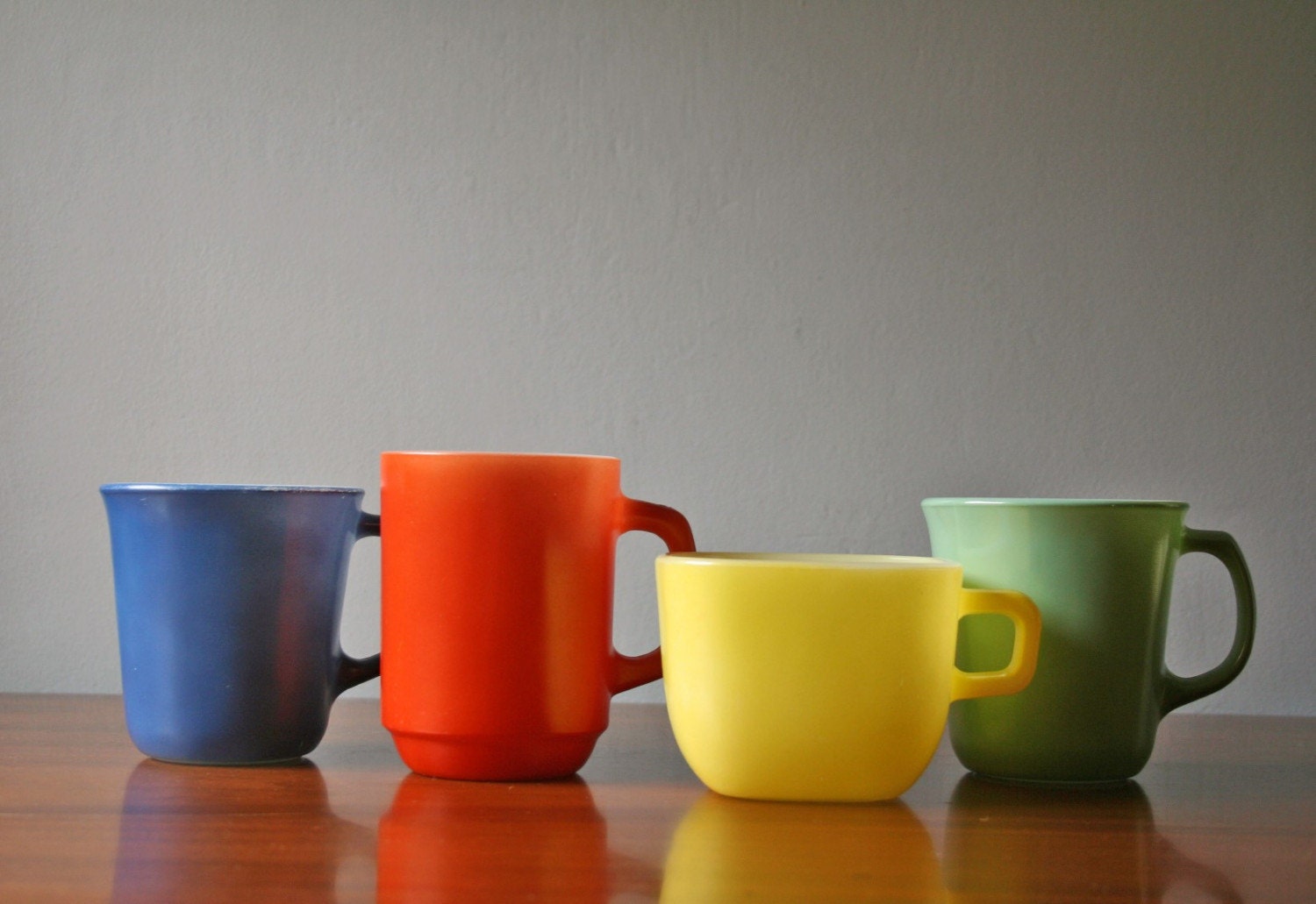 four mix and match colored milkglass coffee mugs