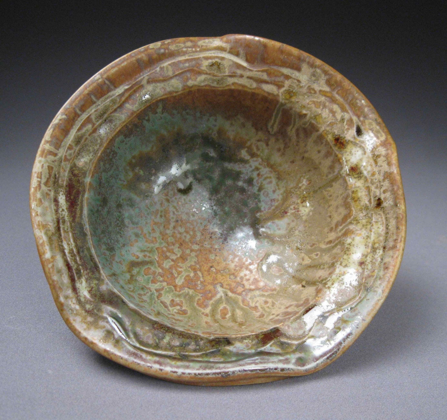 green and orange porcelain bowl