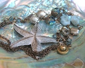 A Brass White Starfish combined with Pearls, Gemstones, Sterling Silver, and Brass