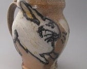 Large mug with rabbits wood fired salt glazed stoneware