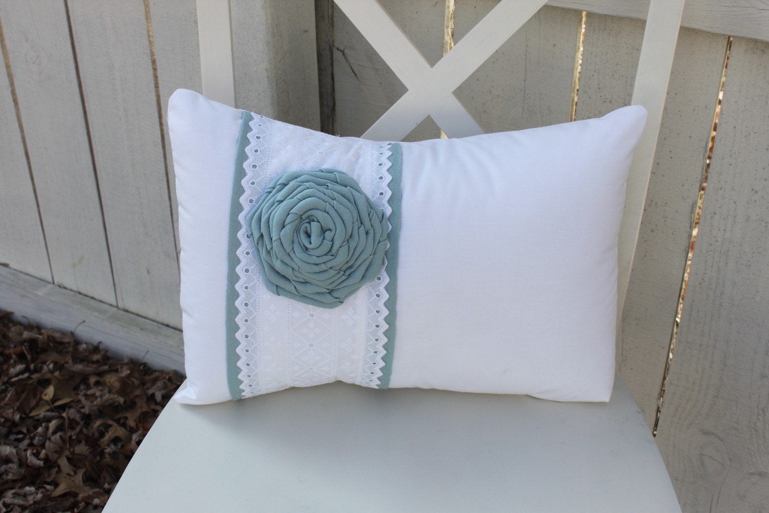 White Pillow with Eyelet Fabric Stripe & Blue Flower Rosette