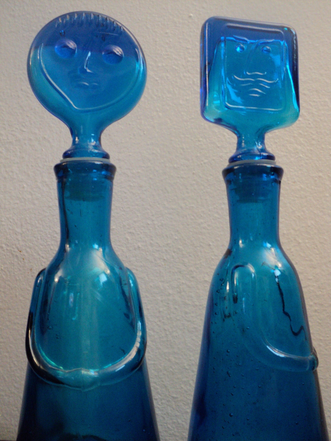 1960's Erik Hoglund style blue glass people bottles decanters