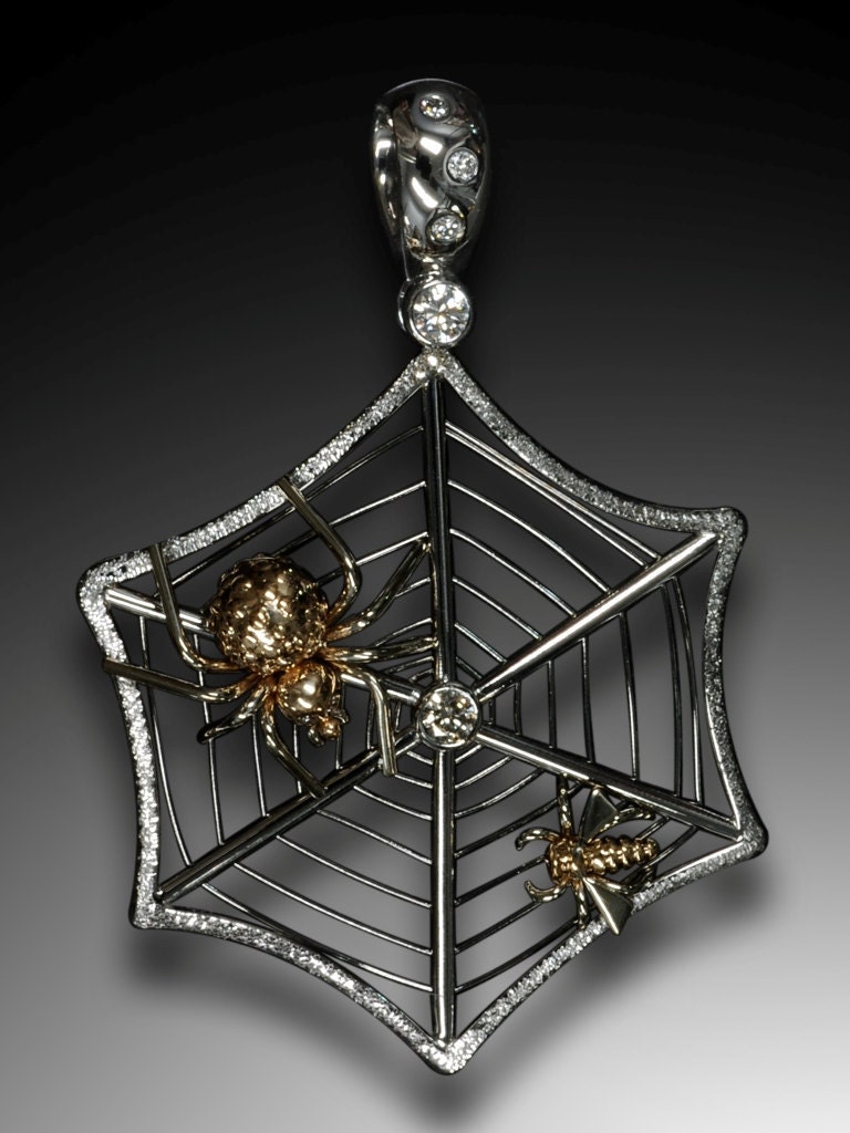 14K white and yellow gold and diamonds Spider on a web with trapped fly as a next victim pendant.
