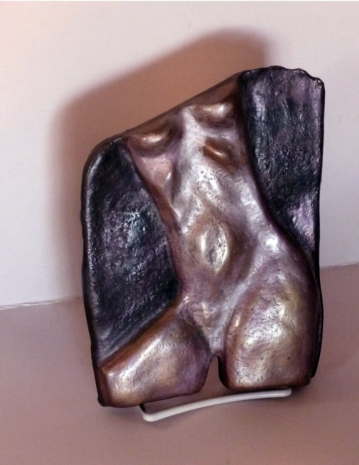 Bronze Haut Relief with purple, black and natural green patina
