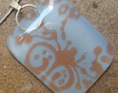 Floral patterned powder blue and brown glass pendant