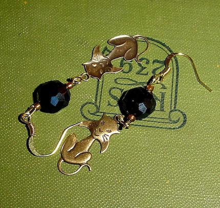 Elegant cat earrings, with brass kitty charms and black crystals