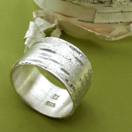 Wide Band Ring. A wide band ring is textured