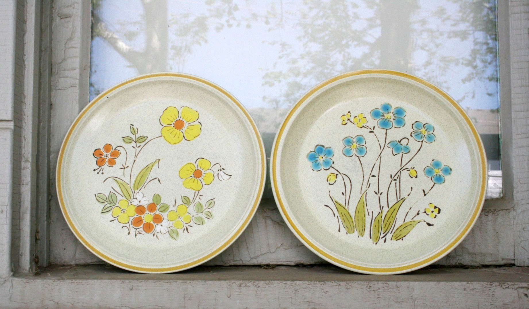 retro set of handpainted hearthside stoneware plates
