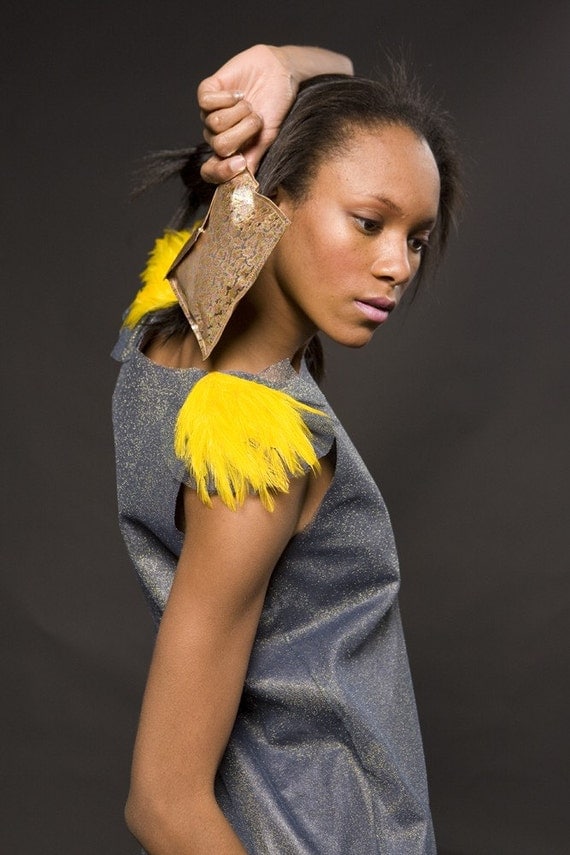 2D-two dresses-transforming space dress no-3 by indie collective, steel blue with bright yellow feather shoulders, day to night, comes in a leather pouch, one of a kind