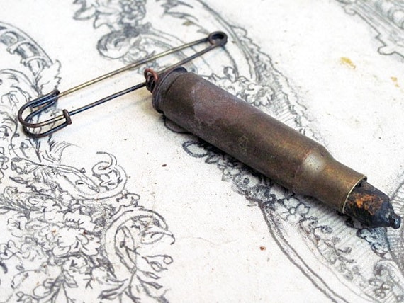 The Written Word. Men's Rifle Cartridge and Pencil Pin.