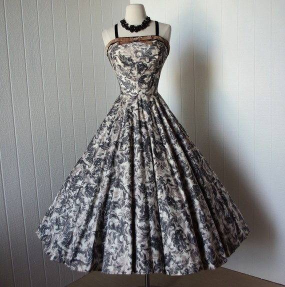 vintage 1950s dress  ...gorgeous cascading plumes on polished cotton with bullet bust and a full circle skirt bombshell pin-up dress