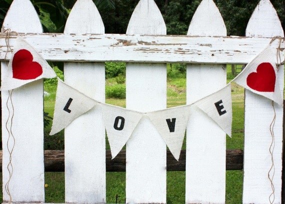 Love banner with red fabric hearts as seen in Gala Wedding Magzine