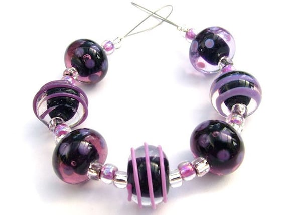 A beautiful set of handmade lampwork beads in shades of purple