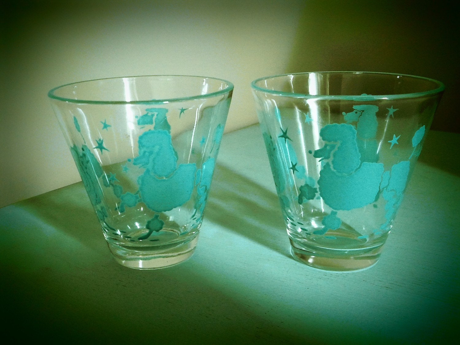 Vintage set of turquoise poodle shot glasses