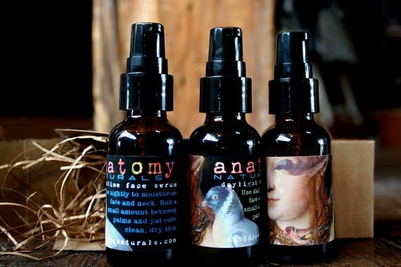 Natural face serum for day and night with nourishing oils and a pretty art collage label