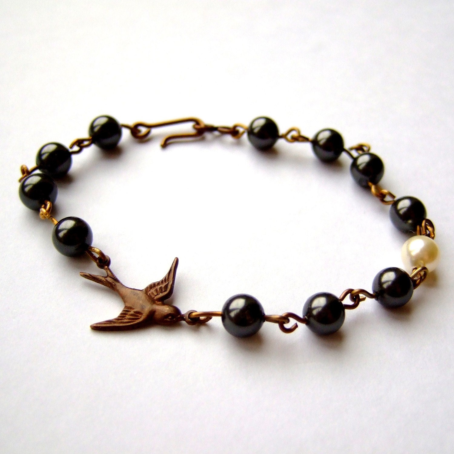 Brass swallow and Swarovski pearl bracelet - "Fly Me To The Moon"