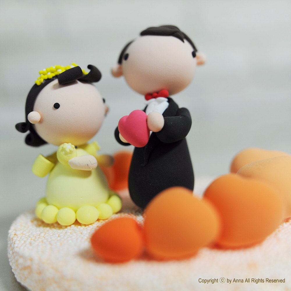 Cute and adorable theme wedding cake topper with heart pool