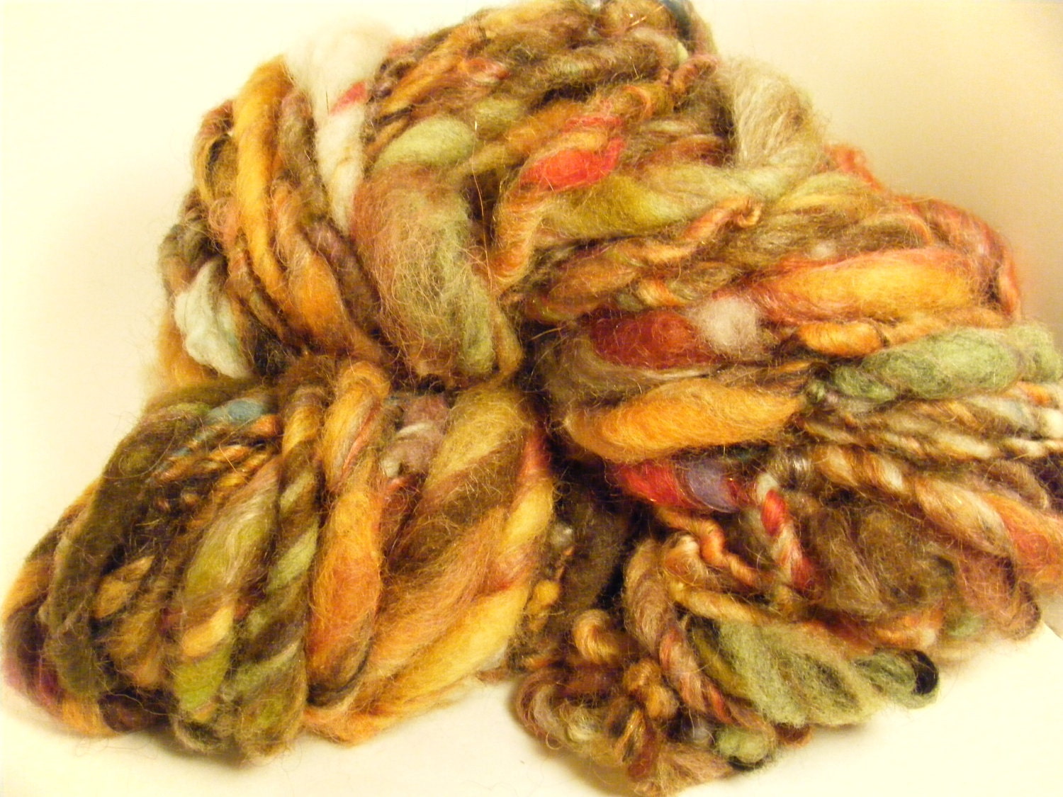 Goldenrod handspun hand dyed art yarn thick and thin singles