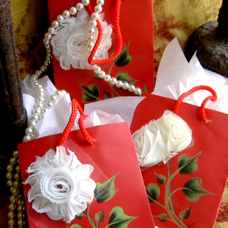 Red Gift Bags with White Fabric Flowers and Handpainted Leaves