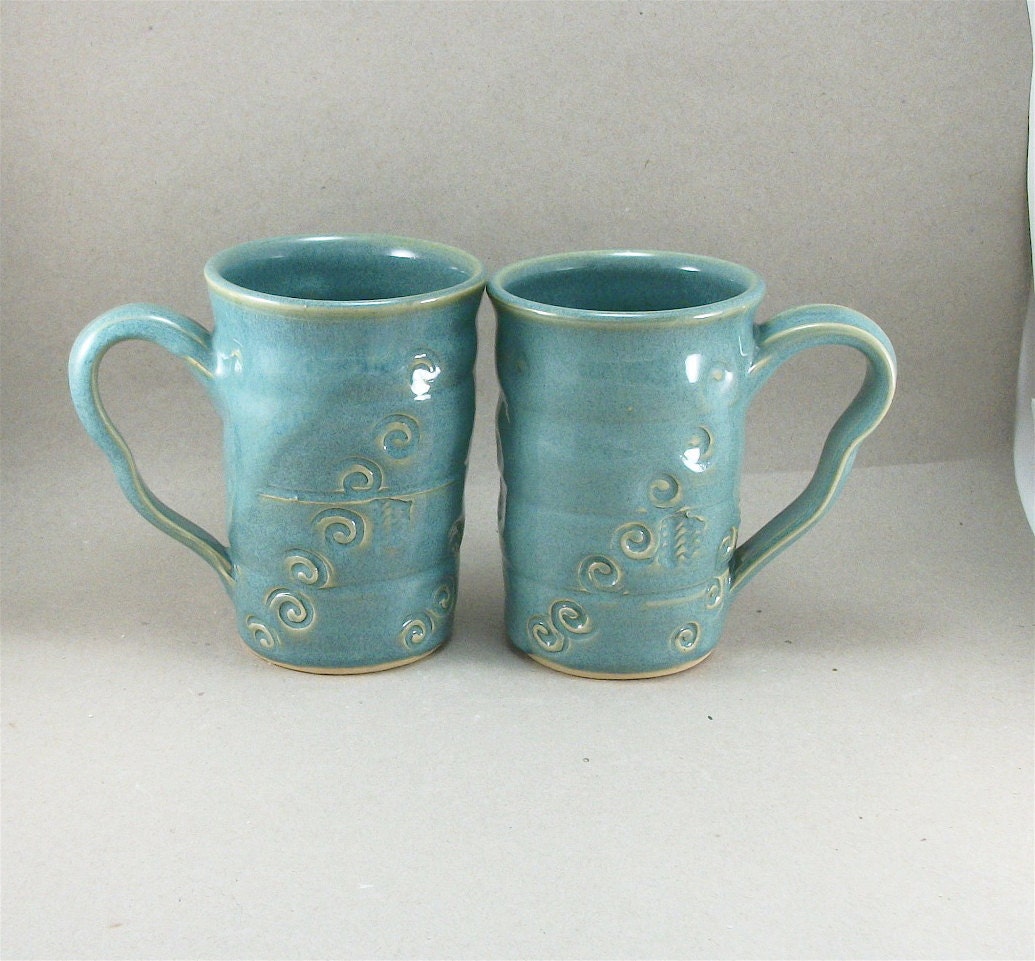 pair of turquoise mugs