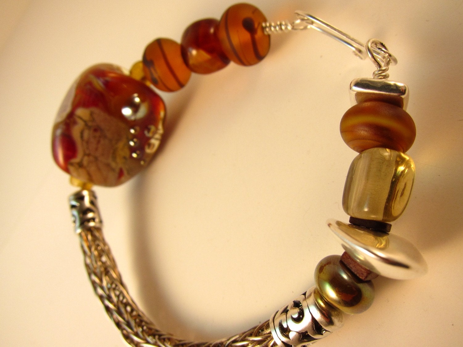 Amber Rich, Sterling Silver viking knit bracelet, lampwork beads