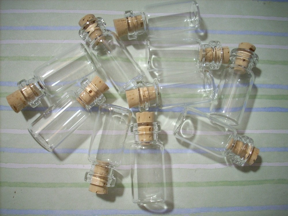 100 Miniature Clear Glass Bottles with Corks 2ML. From charmsgalore