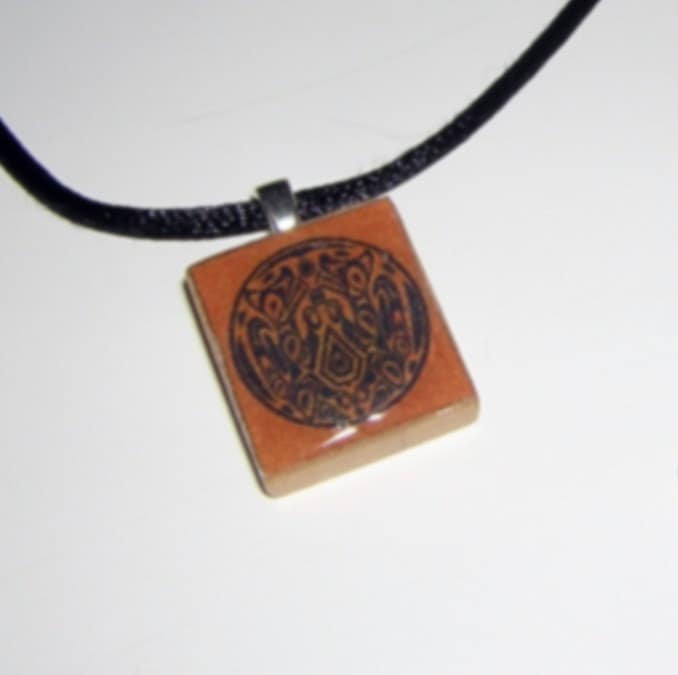NEW MOON Quileute/Werewolf Tattoo Scrabble Tile Pendant. From aripagdesigns