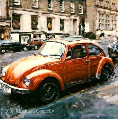 little orange volkswagen beetle