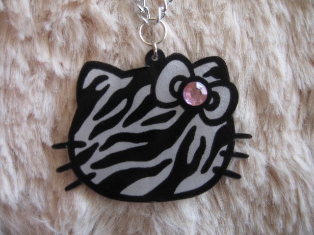Zebra print hello kitty necklace w/ pink rhinestone. From bratfactory