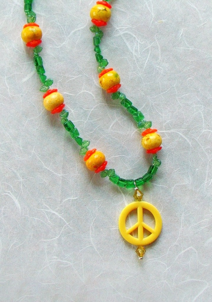 Peace Love And Flowers. You can while wearing this Peace, Love and Flowers necklace. It has a bright yellow peace symbol pendant that hangs from an 18quot; necklace with flowers that