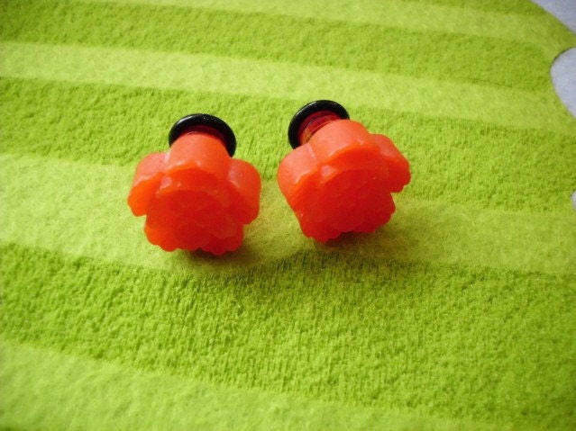 sizes of ear gauges. Red flower ear gauges, size
