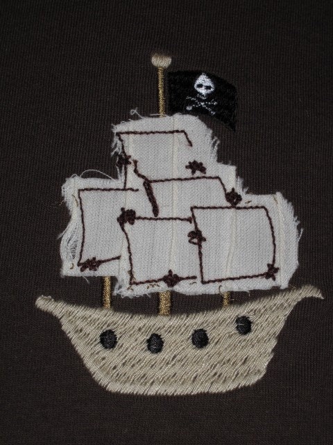 The pirate ship has appliqued sails 