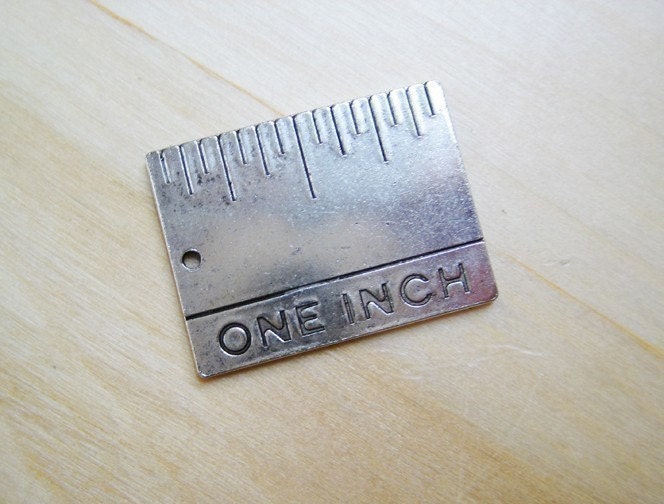 one-inch silver ruler charm, actual size. From snapcrafty