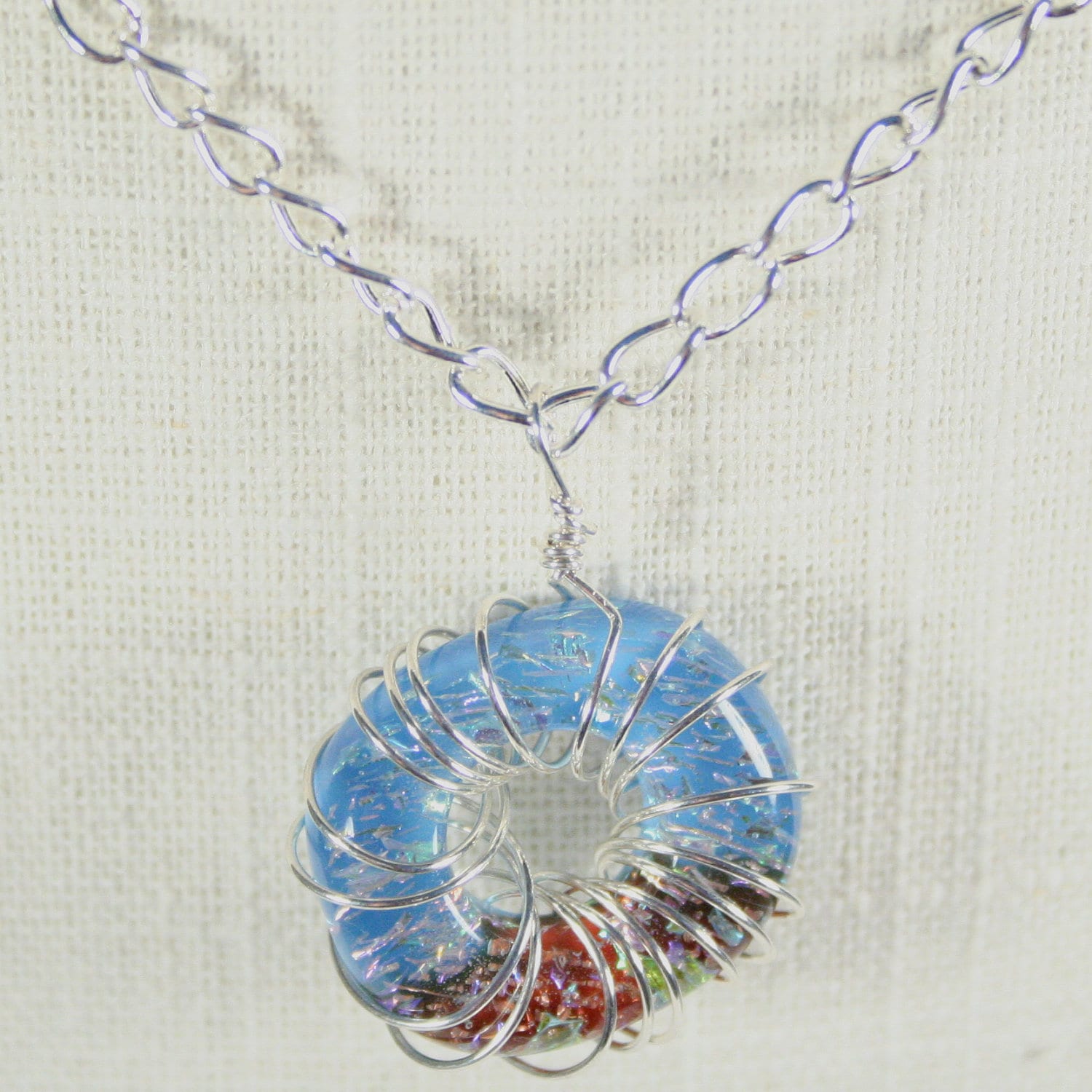 Necklace: Glass ring necklace, Blue and red necklace, wire wrapped necklace