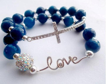 silver sideways cross, love bracelet, blue gemstone