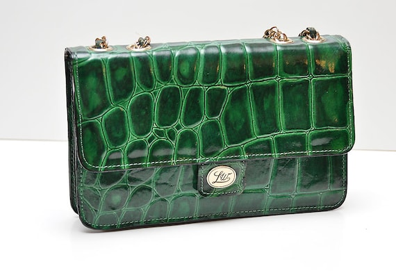 green alligator purse with emerald leather and gold accent chain